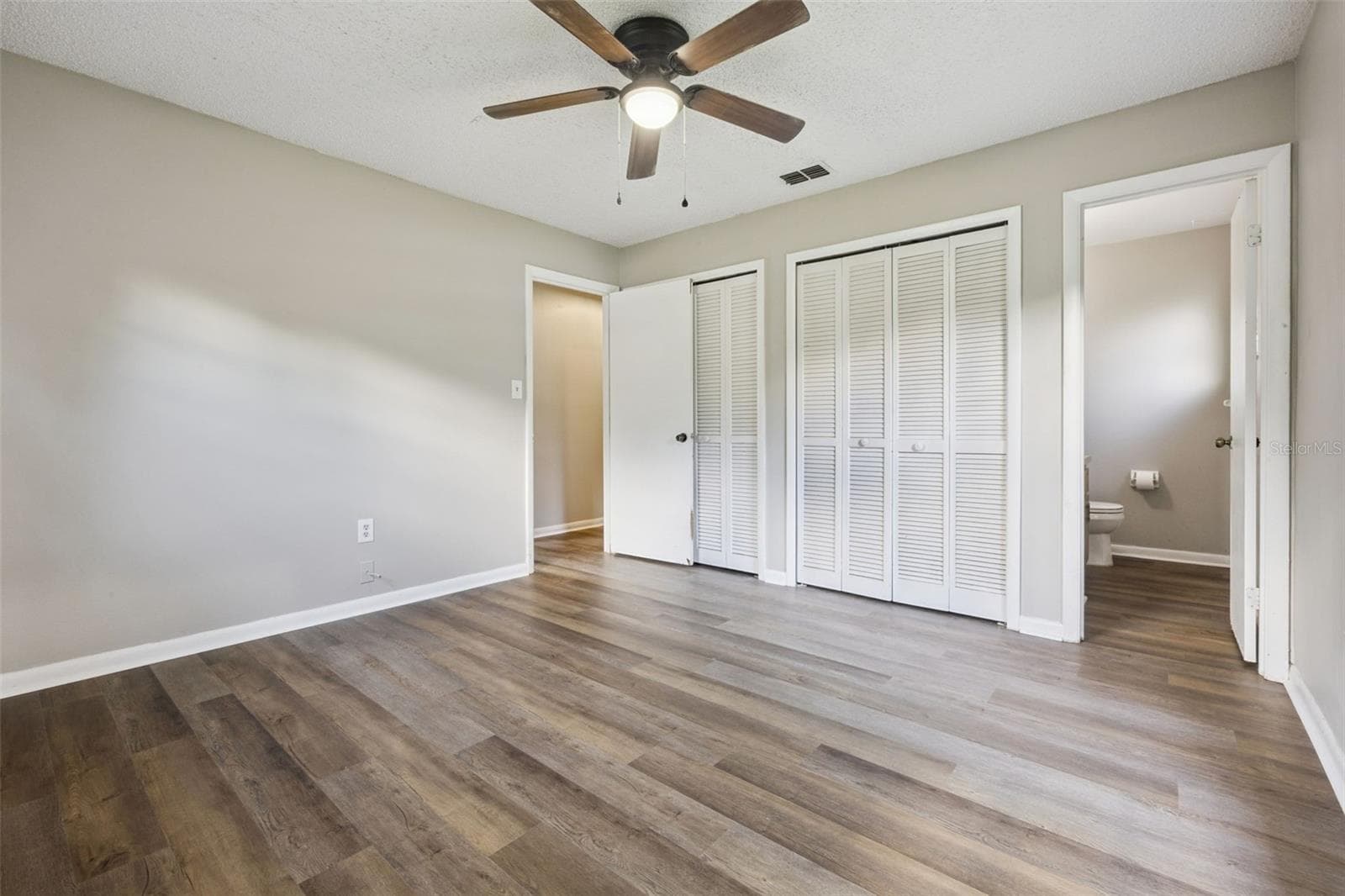 Primary Bedroom has En-suite half bathroom. - 416 WINNERS CIR, LADY LAKE