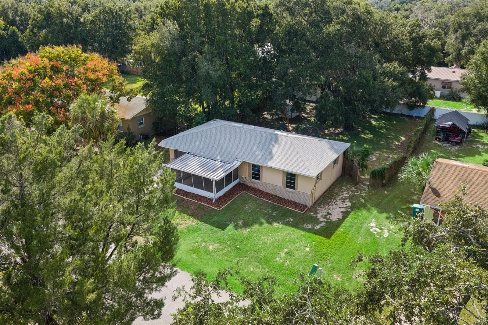 Aerial over front of house. - 416 WINNERS CIR, LADY LAKE