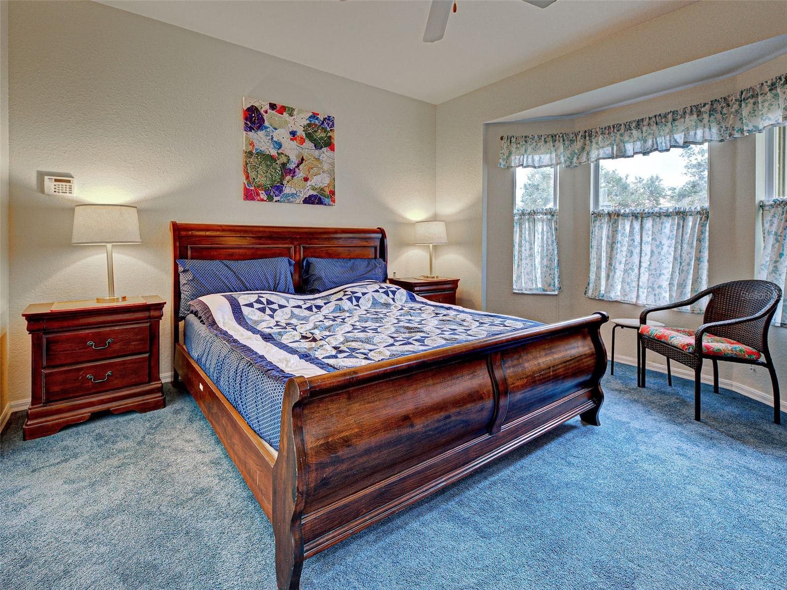 Welcome to the primary bedroom featuring a walk-in closet and an ensuite bathroom. - 251 VISTA DEL LAGO WAY, VENICE