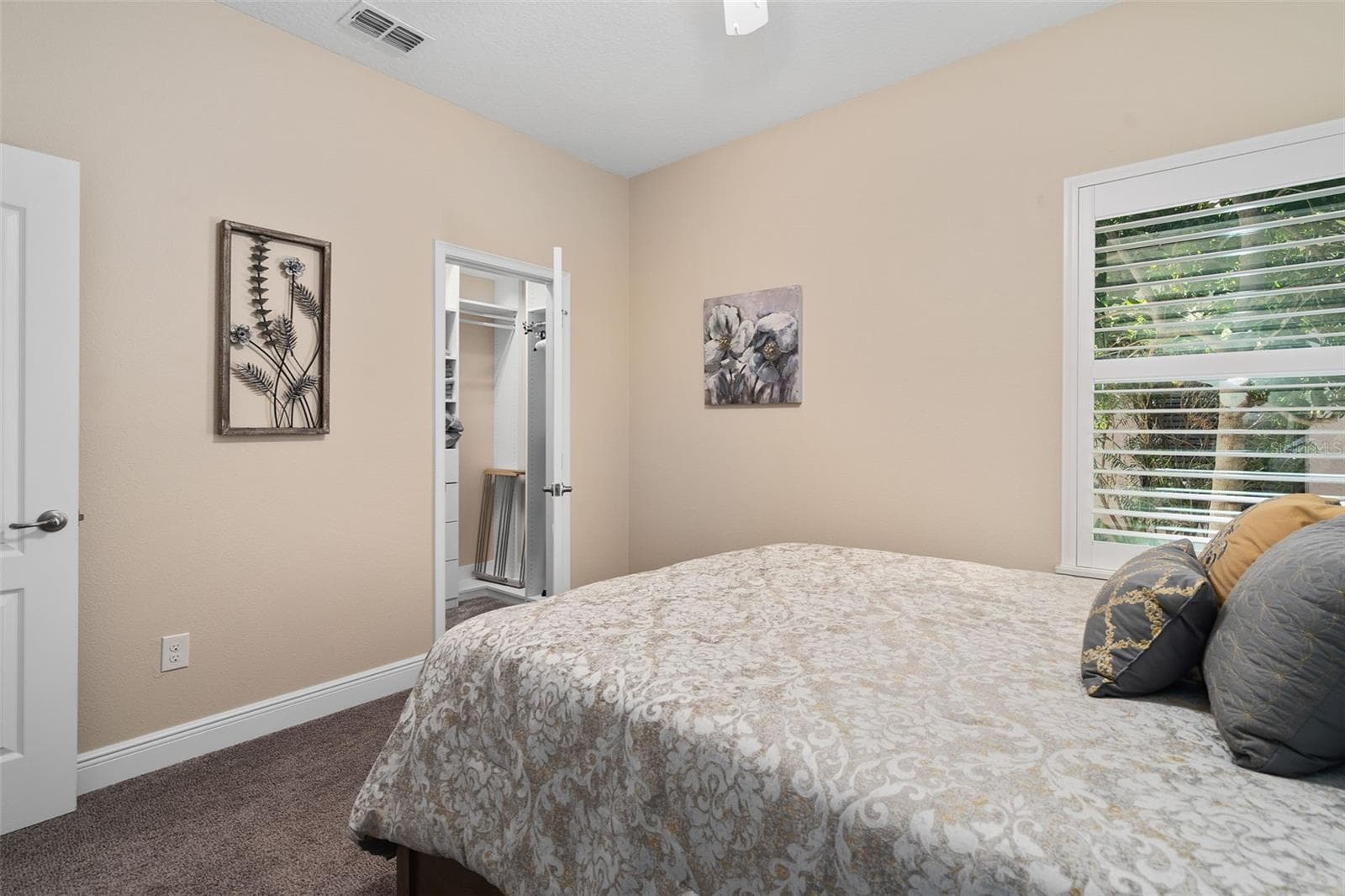 Bedroom 2 offers a Walk-in Custom Organized closet - 2607 CLEMSON RIDGE CT, CLERMONT