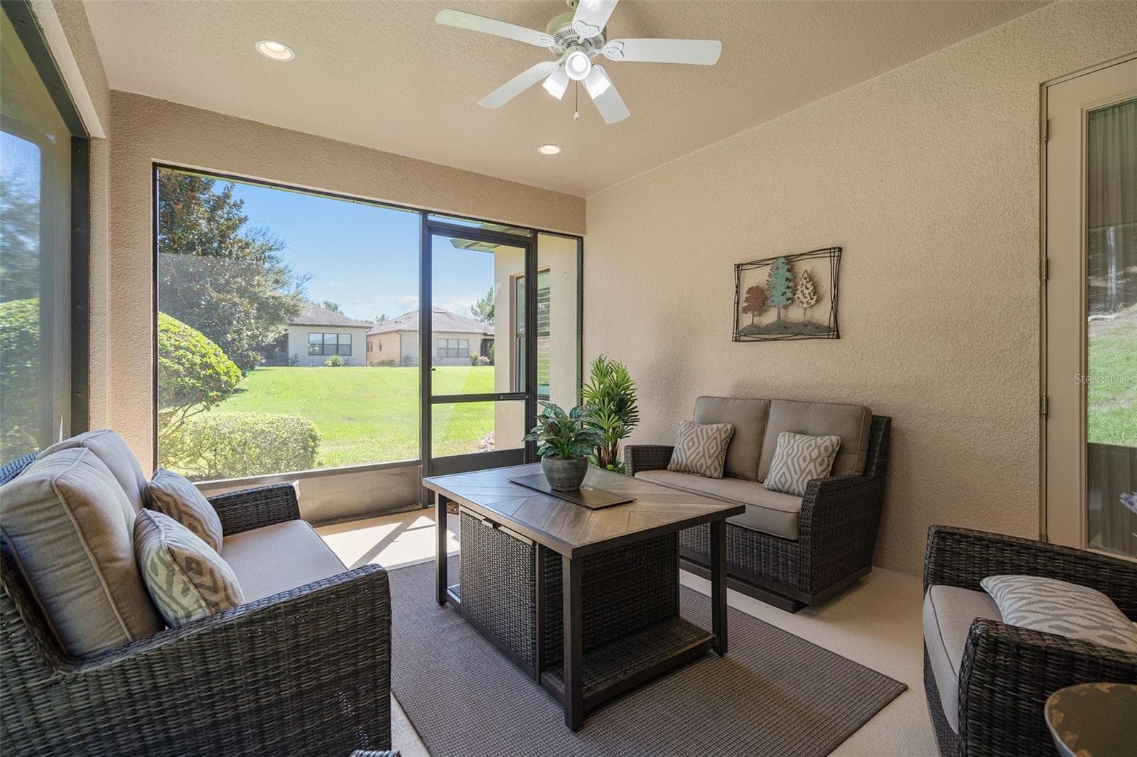 Screened Lanai with a view of the backyard - 2607 CLEMSON RIDGE CT, CLERMONT
