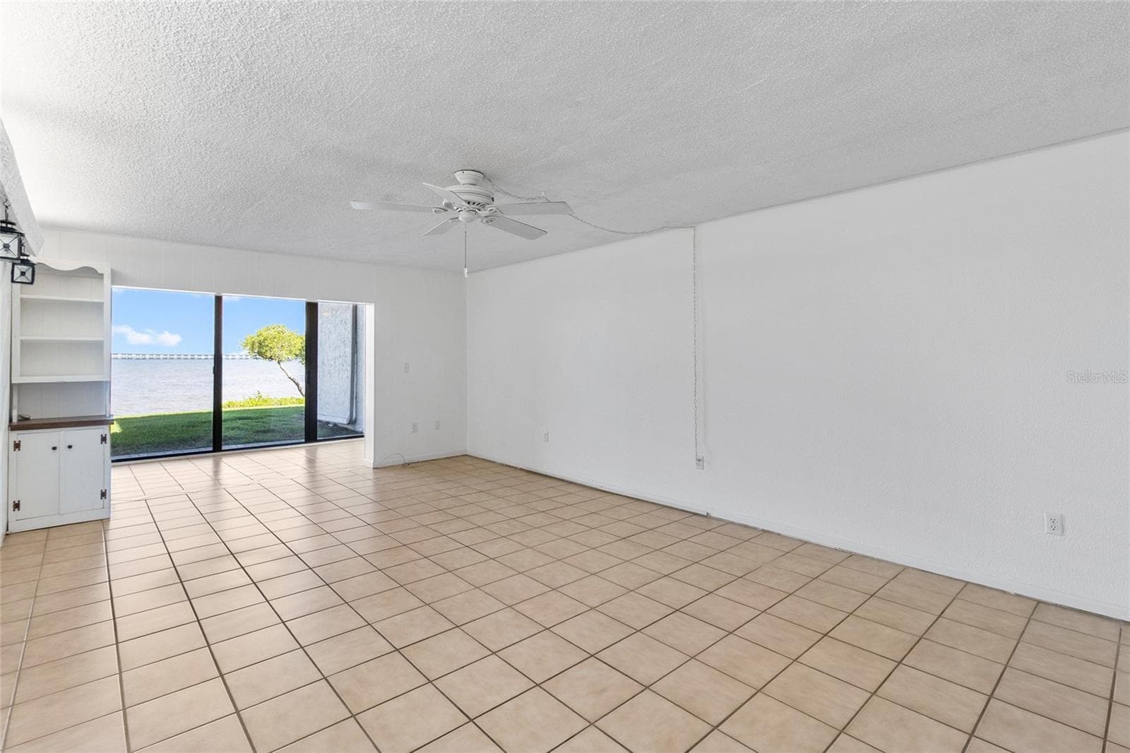 Living area from other side - looking towards water view. - 2980 HAINES BAYSHORE RD #105, CLEARWATER