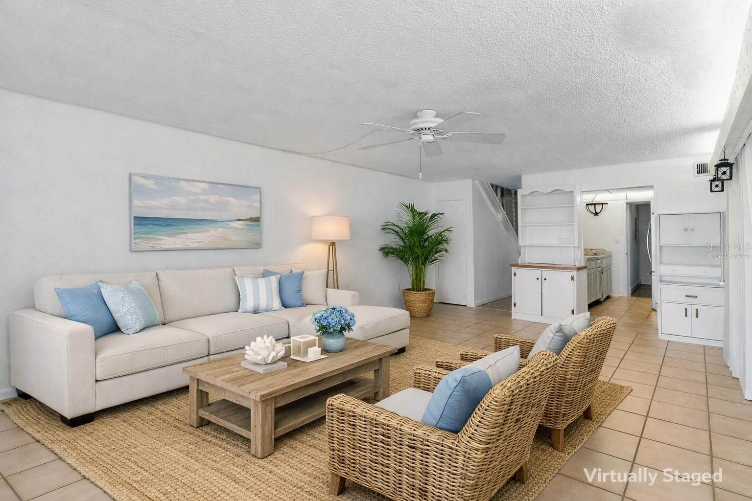 Virtually staged living area looking toward kitchen - 2980 HAINES BAYSHORE RD #105, CLEARWATER