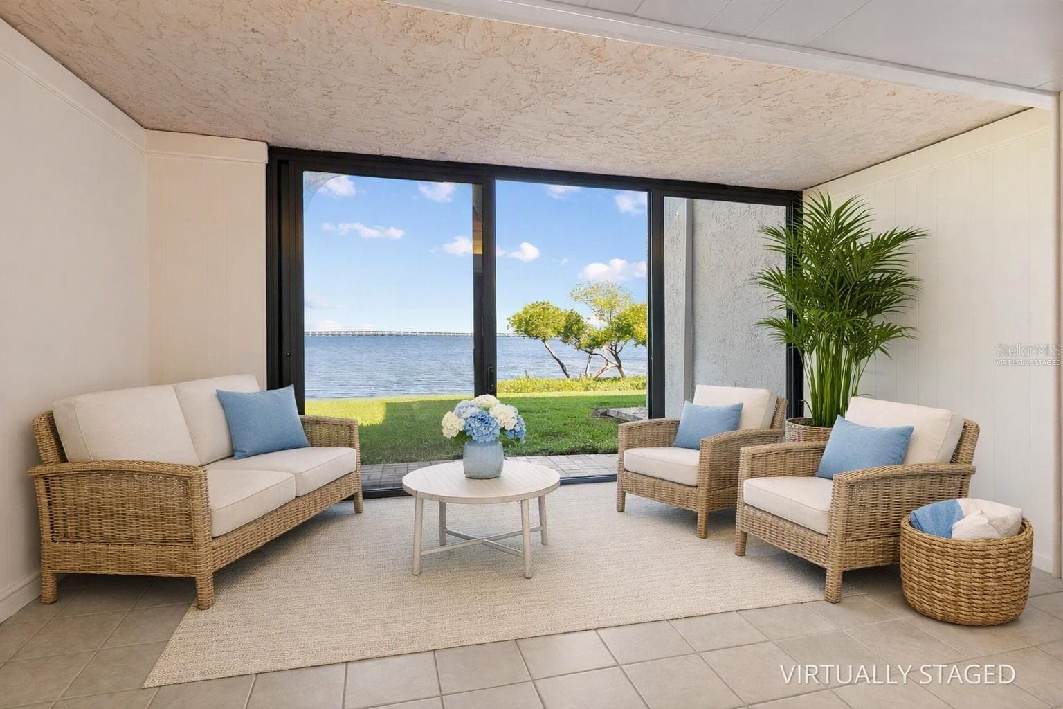 Virtually staged sunroom with full water view. - 2980 HAINES BAYSHORE RD #105, CLEARWATER