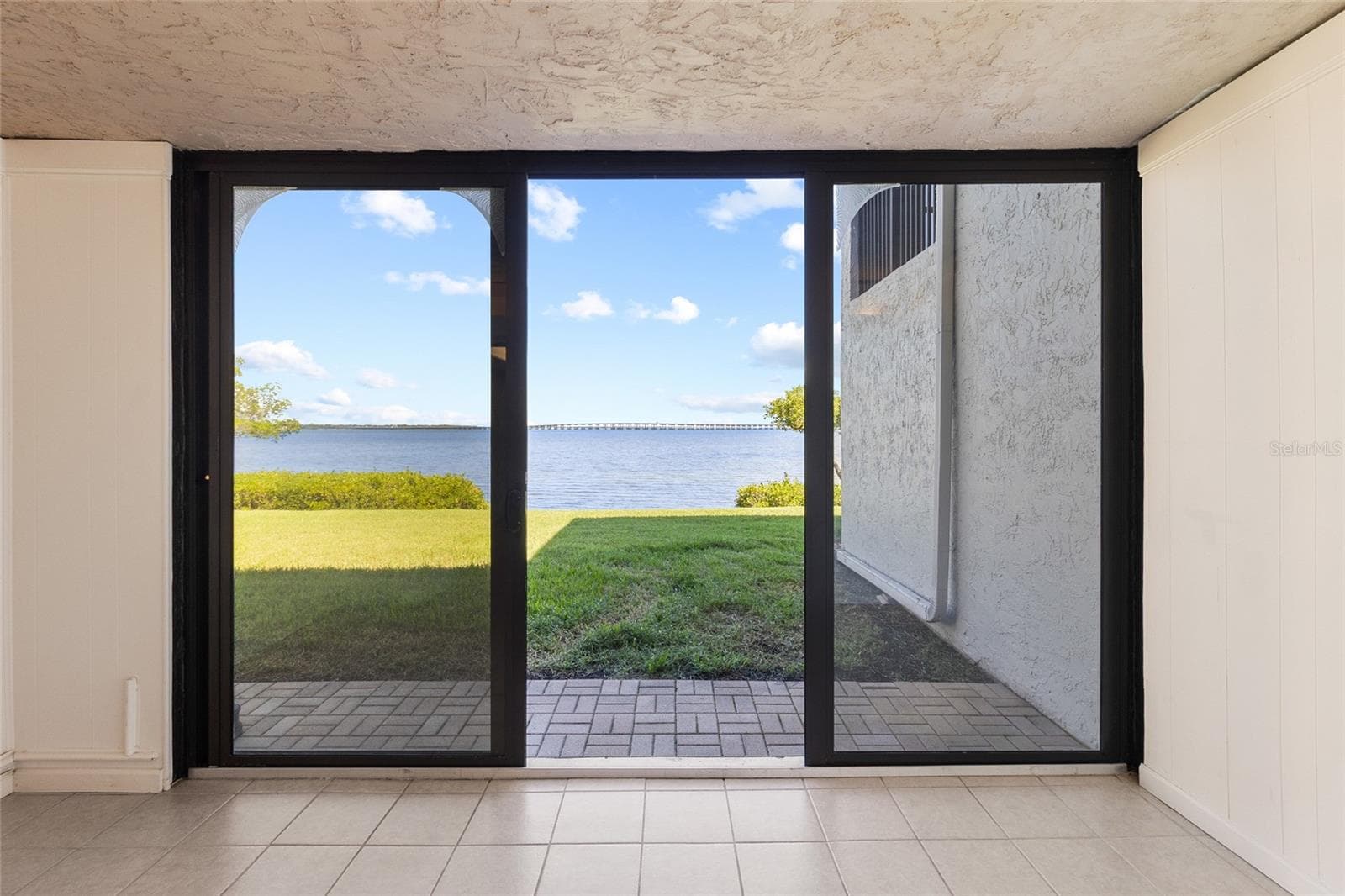 Sunroom - off living area with full water view - 2980 HAINES BAYSHORE RD #105, CLEARWATER