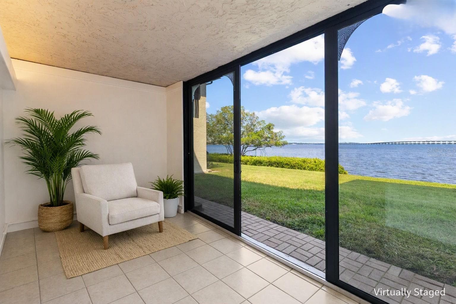 Virtually staged sunroom from other side - with panoramic water views - 2980 HAINES BAYSHORE RD #105, CLEARWATER