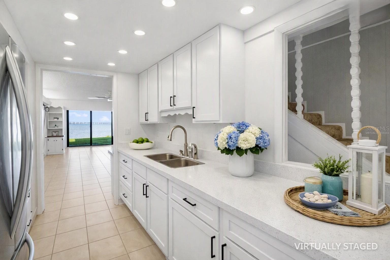 VIRTUALLY STAGED AND ENHANCED kitchem -to help envision recessed lighting, quart counter tops and white cabinets - 2980 HAINES BAYSHORE RD #105, CLEARWATER