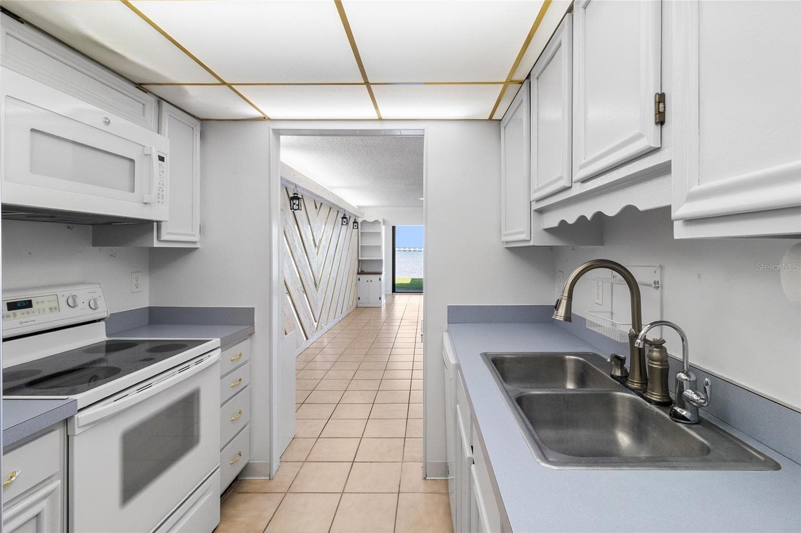 Kitchen looking towards the living area - 2980 HAINES BAYSHORE RD #105, CLEARWATER