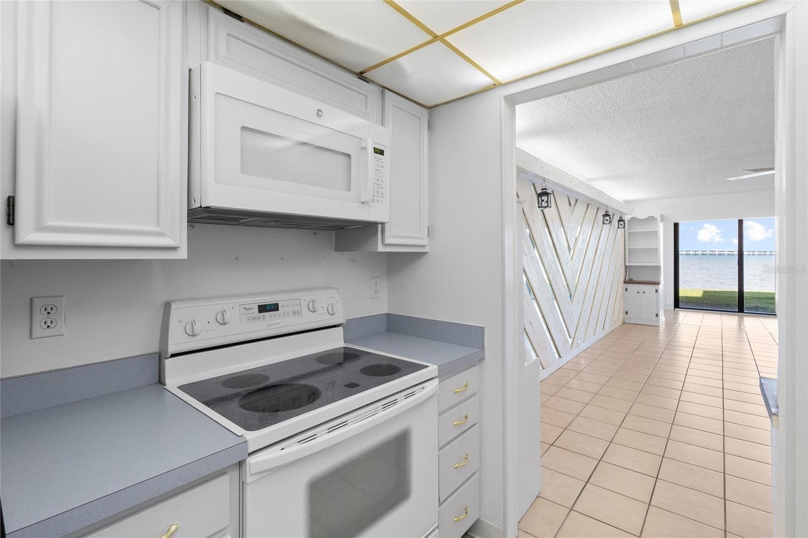 Kitchen looking toward water view. - 2980 HAINES BAYSHORE RD #105, CLEARWATER
