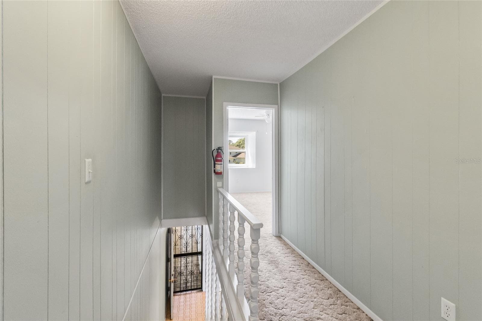 Stairway looking down to main level - 2980 HAINES BAYSHORE RD #105, CLEARWATER