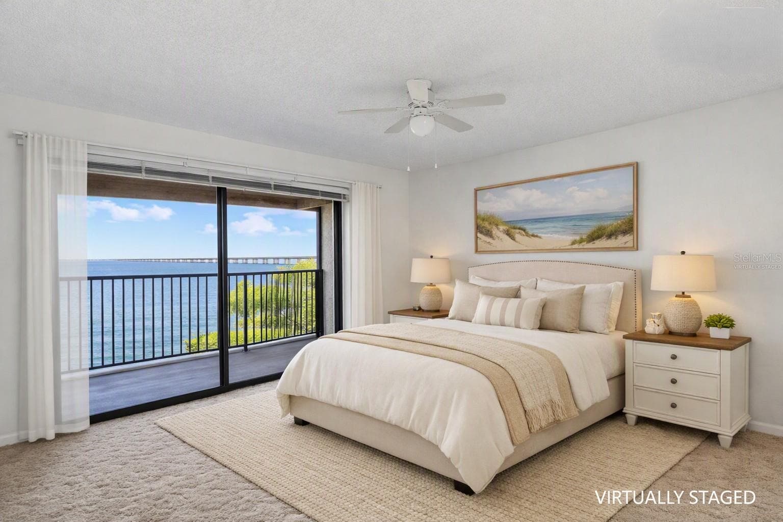 Virtually staged - primary bedroom over looking the balcony with full panoramic water views - 2980 HAINES BAYSHORE RD #105, CLEARWATER