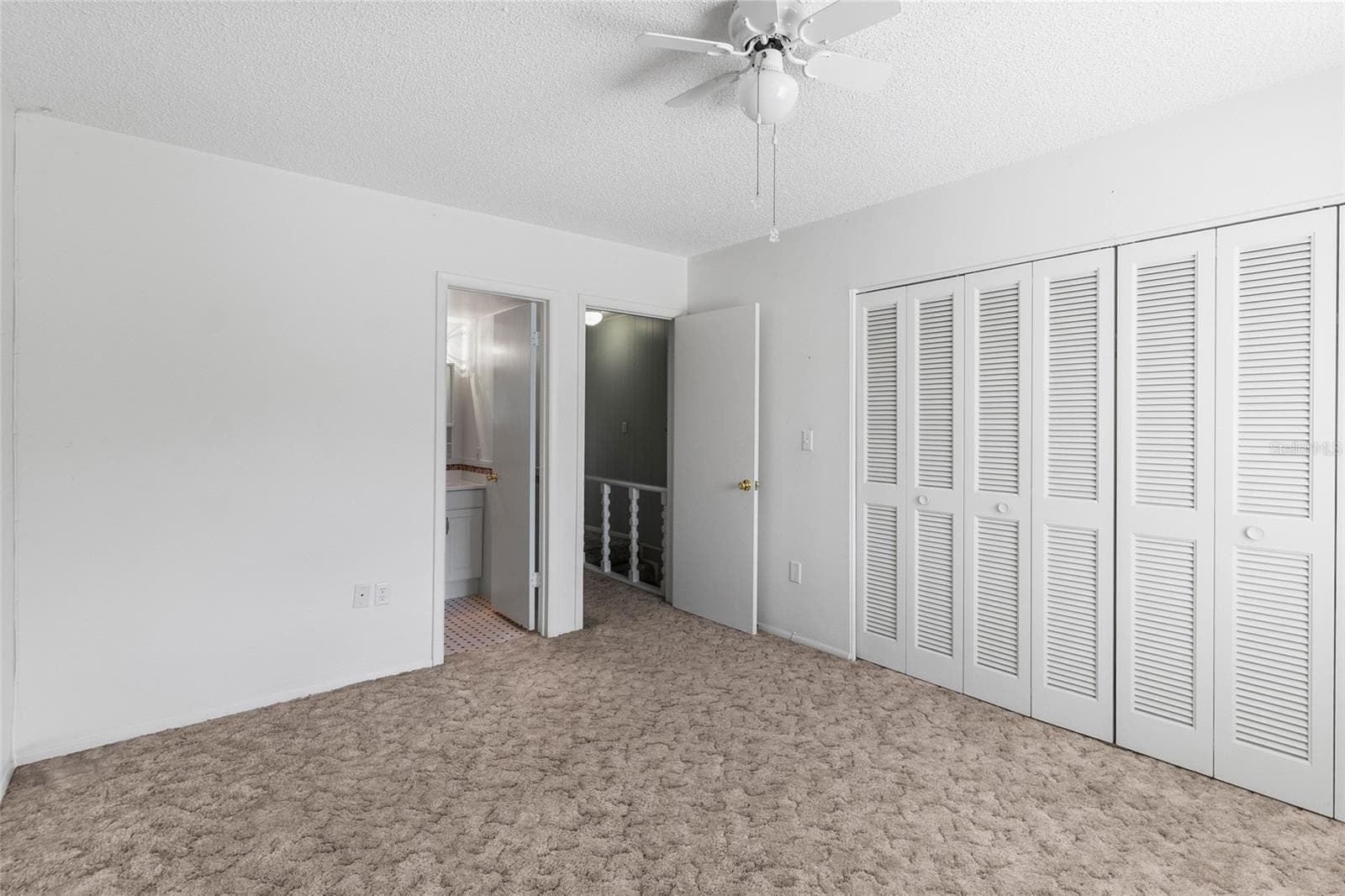 Scond bedroom looking toward private ensuite bath - 2980 HAINES BAYSHORE RD #105, CLEARWATER