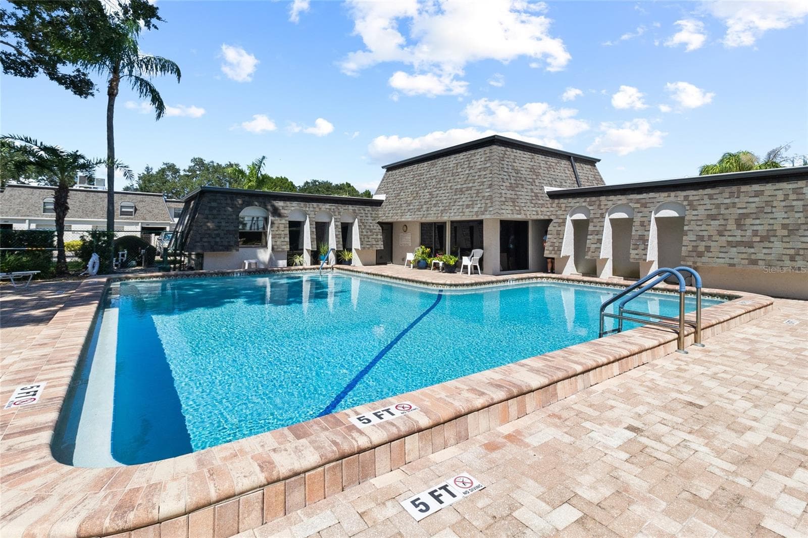 Pool area - looking toward club house - 2980 HAINES BAYSHORE RD #105, CLEARWATER