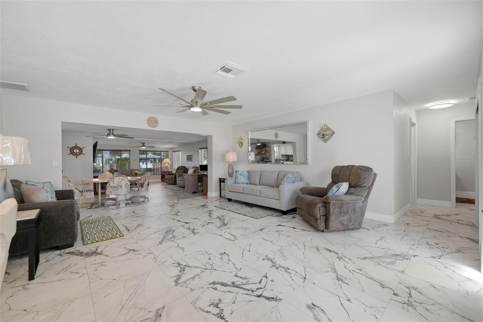 2 living areas | 2 dining areas - sunken family room. Water view upon entering home - 5513 BOWLINE BND, NEW PORT RICHEY