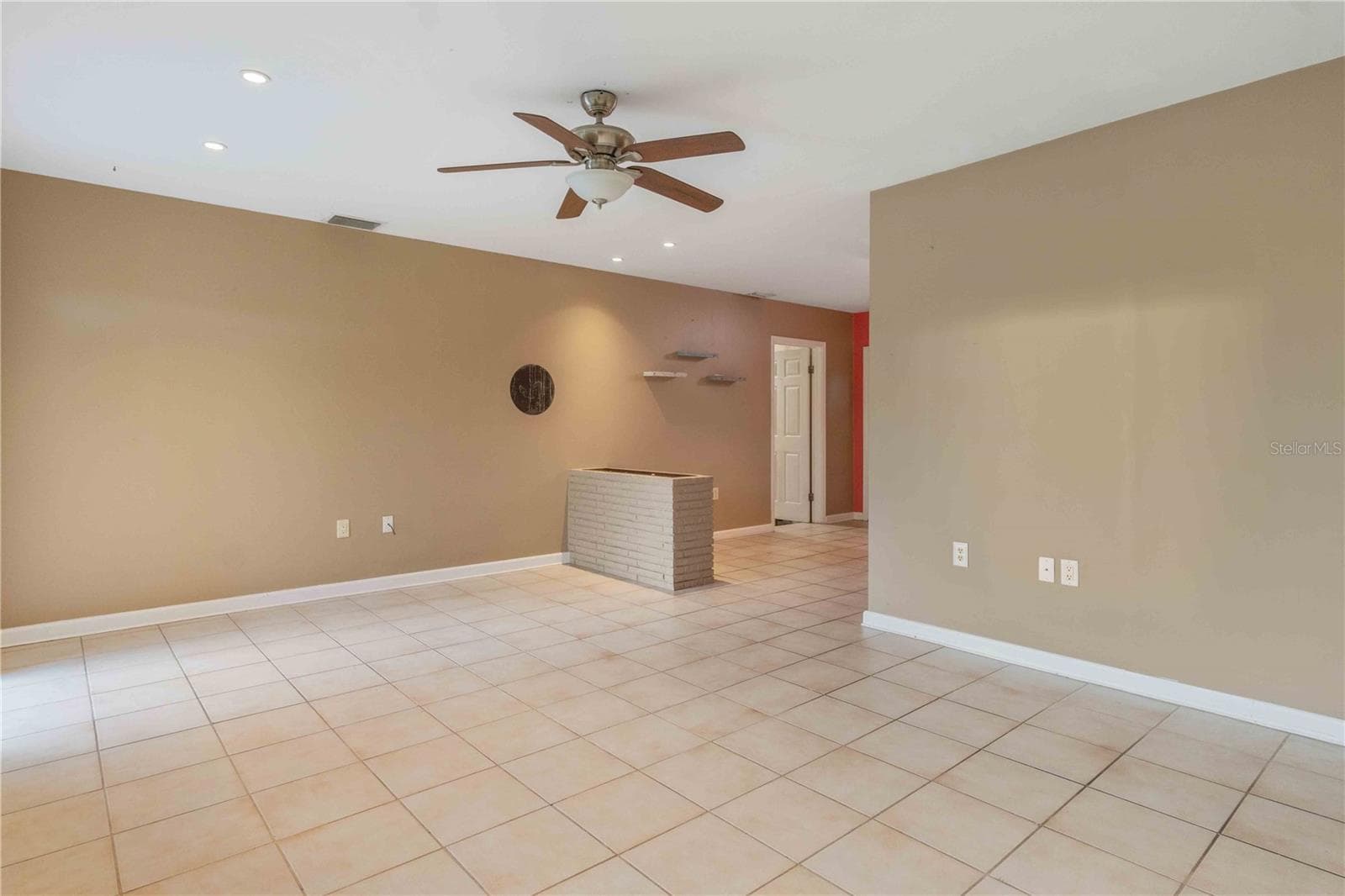 Living room facing kitchen - 11144 3RD AVE, PUNTA GORDA