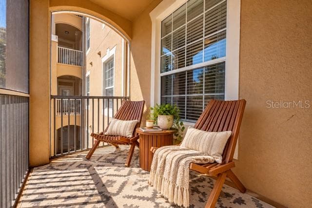 Read a book & sip on an ice cold drink from the screened balcony. - 2778 ALMATON LOOP #204, KISSIMMEE