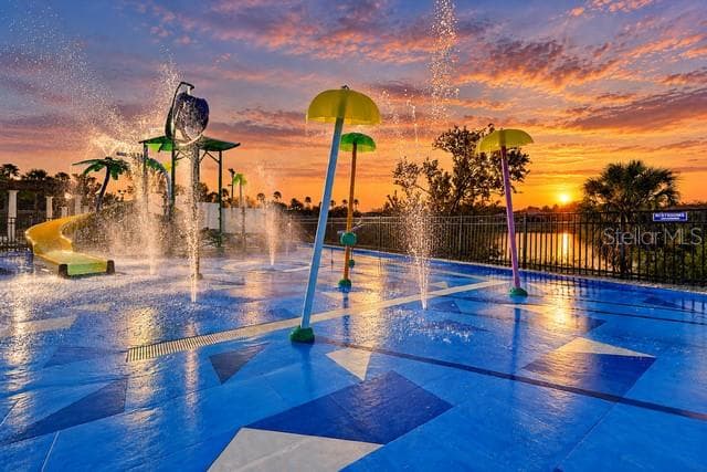 West facing water view from the pool and splash pad to enjoy those colorful Florida sunsets each night. <Virtual Twilight> - 2778 ALMATON LOOP #204, KISSIMMEE