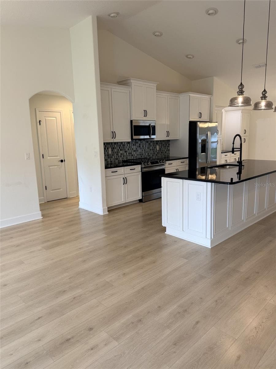 Dining room and kitchen - 21 WOOD CLIFT LN, PALM COAST
