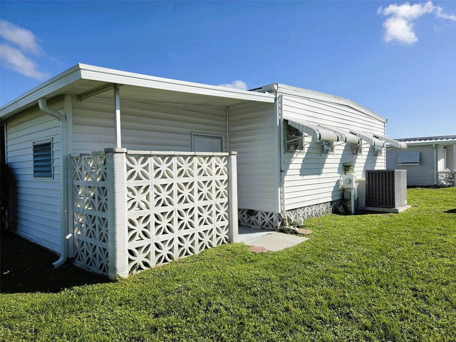 Back of home with a nice privacy wall - 3308 OVER CUP OAK TER, SARASOTA