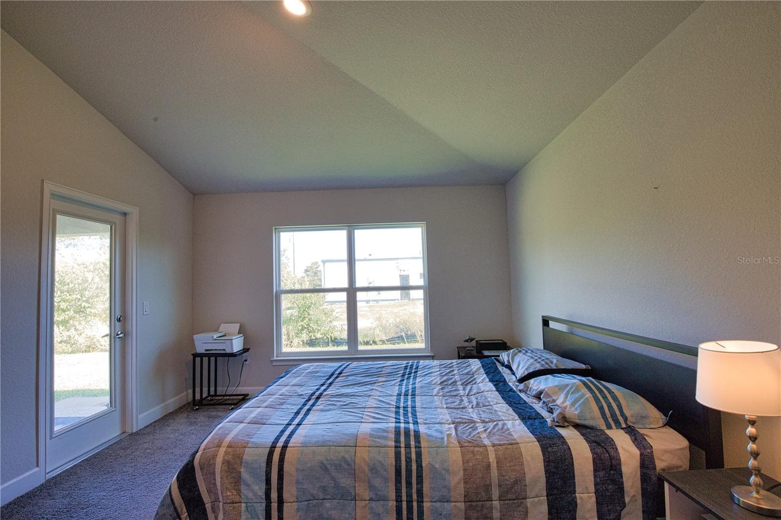 Primary bedroom with door out to the covered lanai - 14062 HOPEWELL AVE, PORT CHARLOTTE