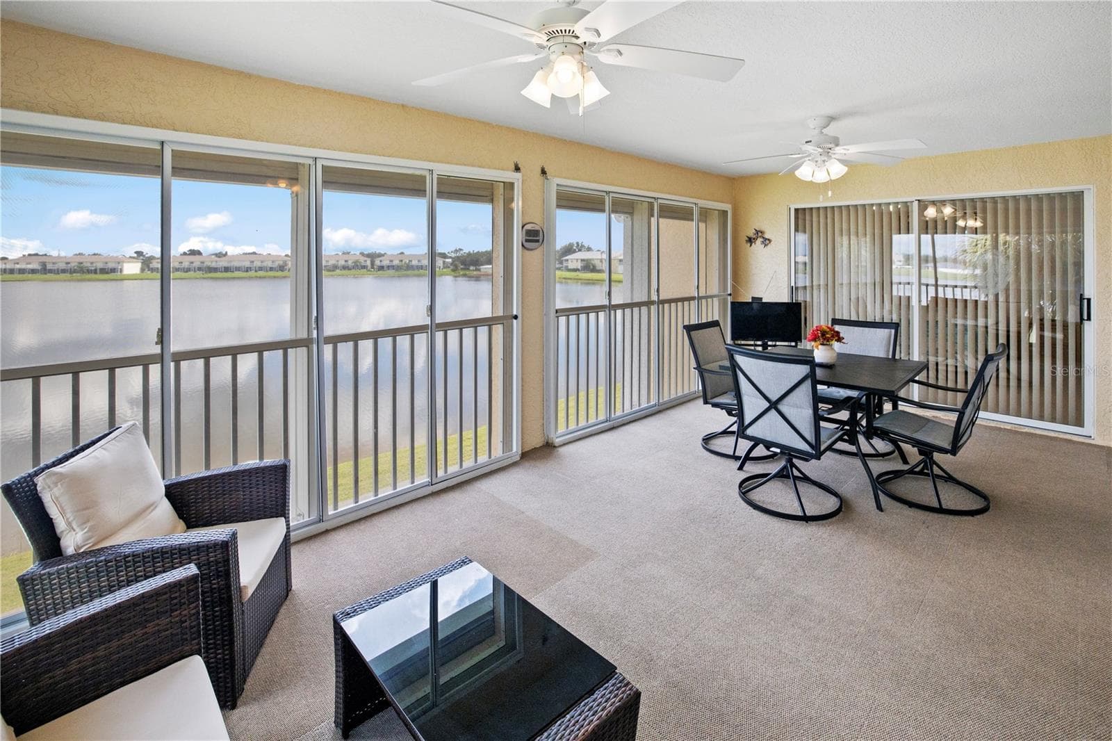 Impressive 20ft, 4 Season, Screened Lanai with Roll Down Shutters Peaceful View of Lake Rio - 26283 NADIR RD #201, PUNTA GORDA