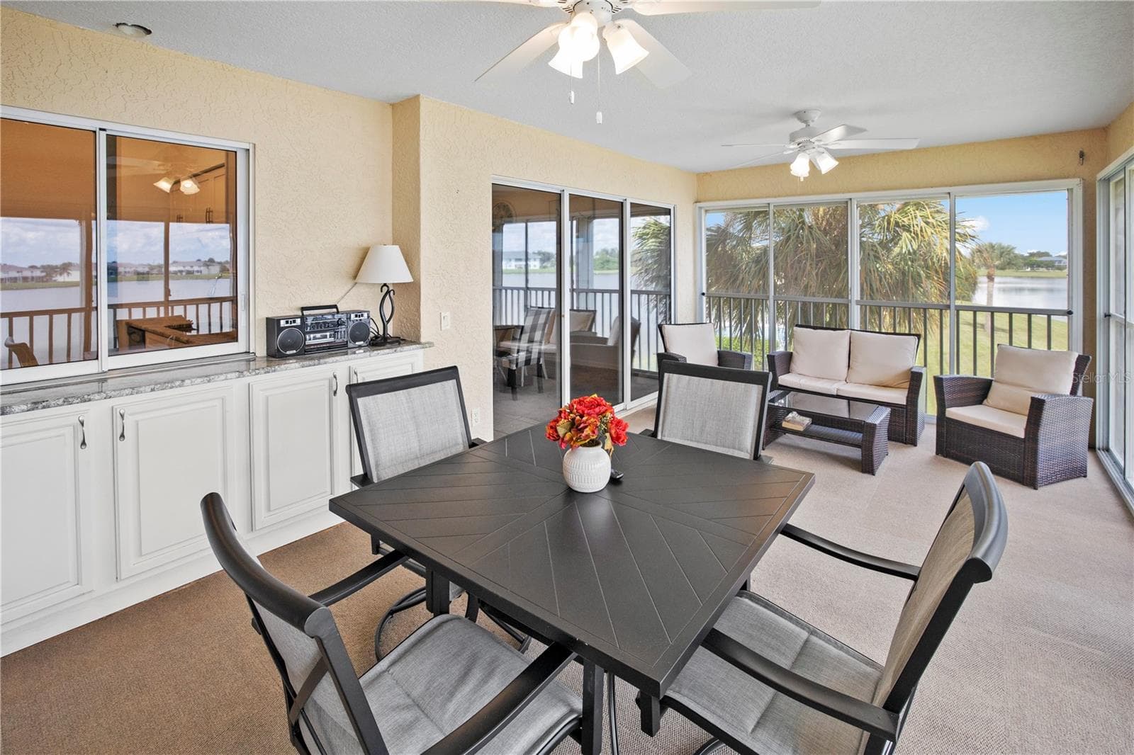 Impressive 20ft, 4 Season, Screened Lanai with Roll Down Shutters and Lake Rio View - 26283 NADIR RD #201, PUNTA GORDA