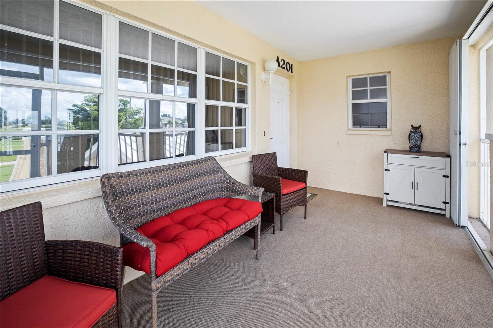 Large, Screened Front Entry with Accordian Shutters - 26283 NADIR RD #201, PUNTA GORDA