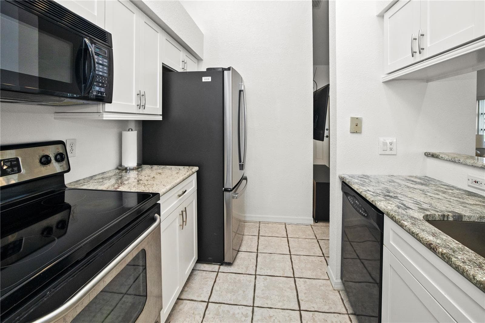 Stainless Appliances and Lots of Cabinets for Storage - 26283 NADIR RD #201, PUNTA GORDA