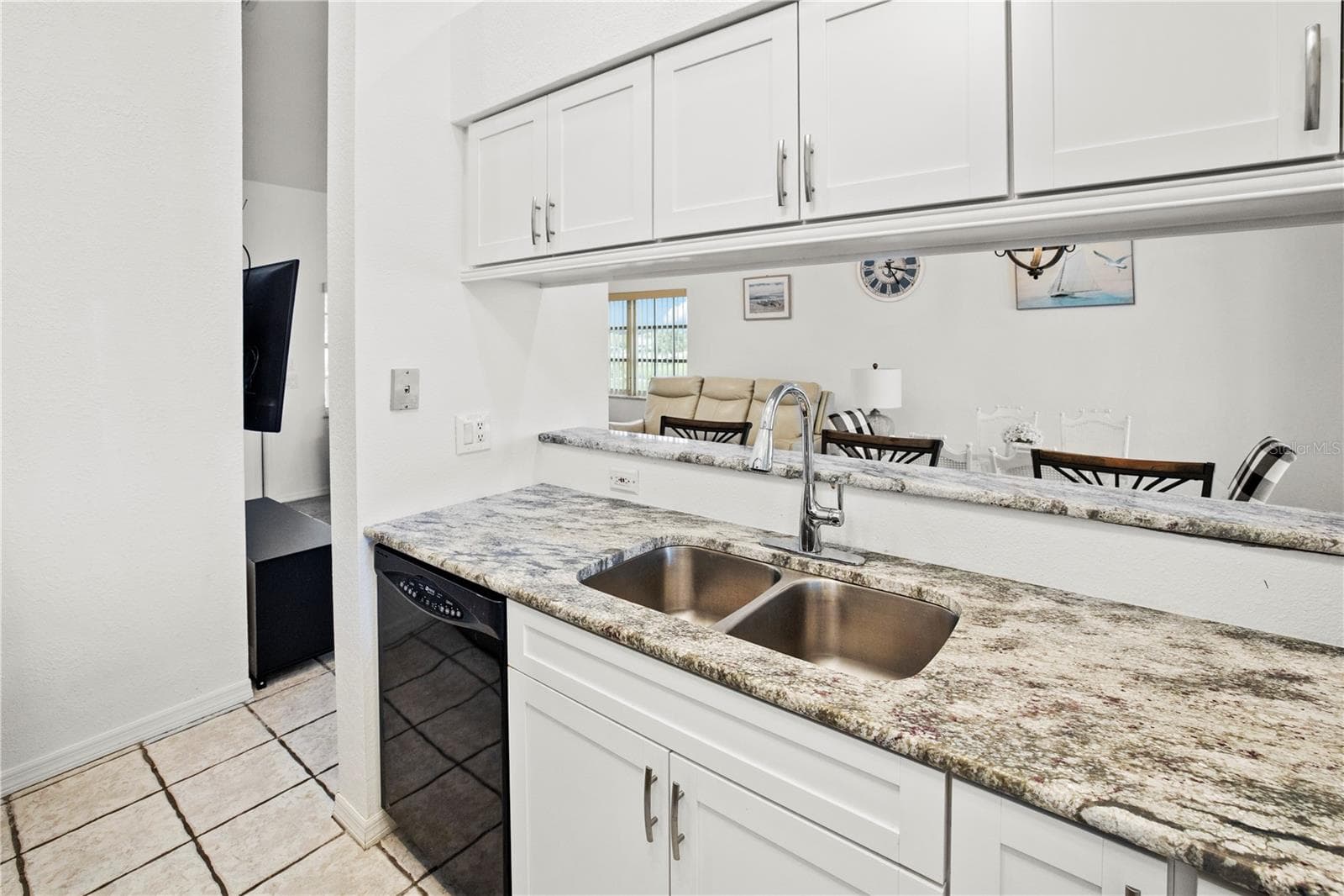 Kitchen with Breakfast Bar to Dining Area - 26283 NADIR RD #201, PUNTA GORDA