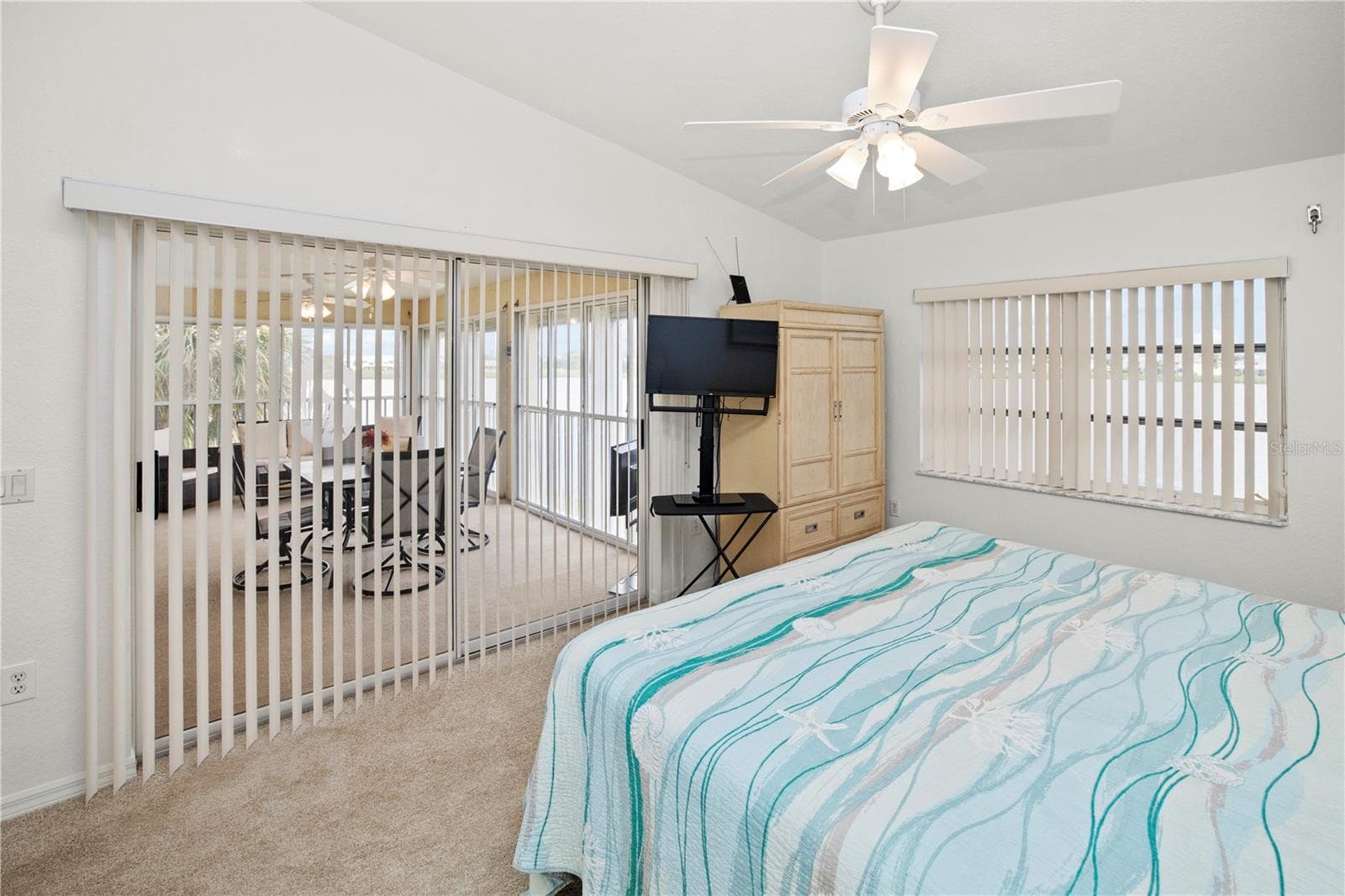 Spacious 12' x 16' Primary Bedroom with Gorgeous Lake Views and Sliders out to the Relaxing Lanai - 26283 NADIR RD #201, PUNTA GORDA