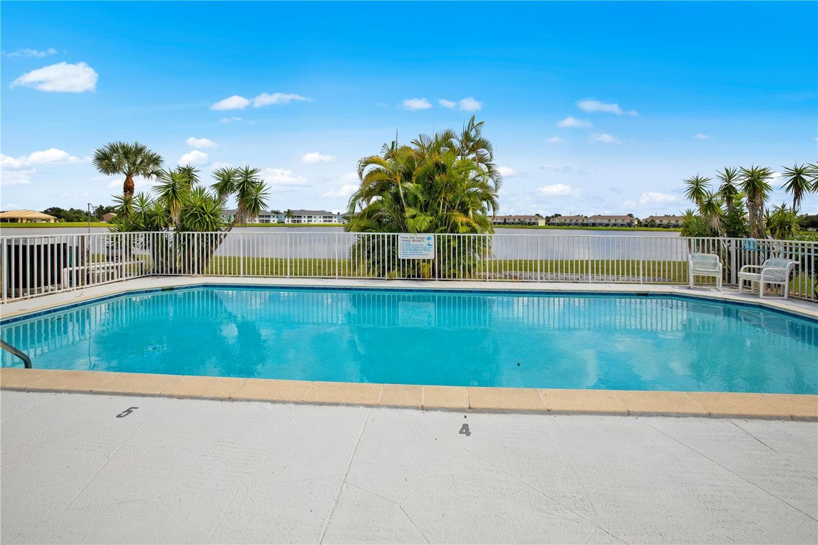 refreshing pool overlooking Lake Rio - 26283 NADIR RD #201, PUNTA GORDA