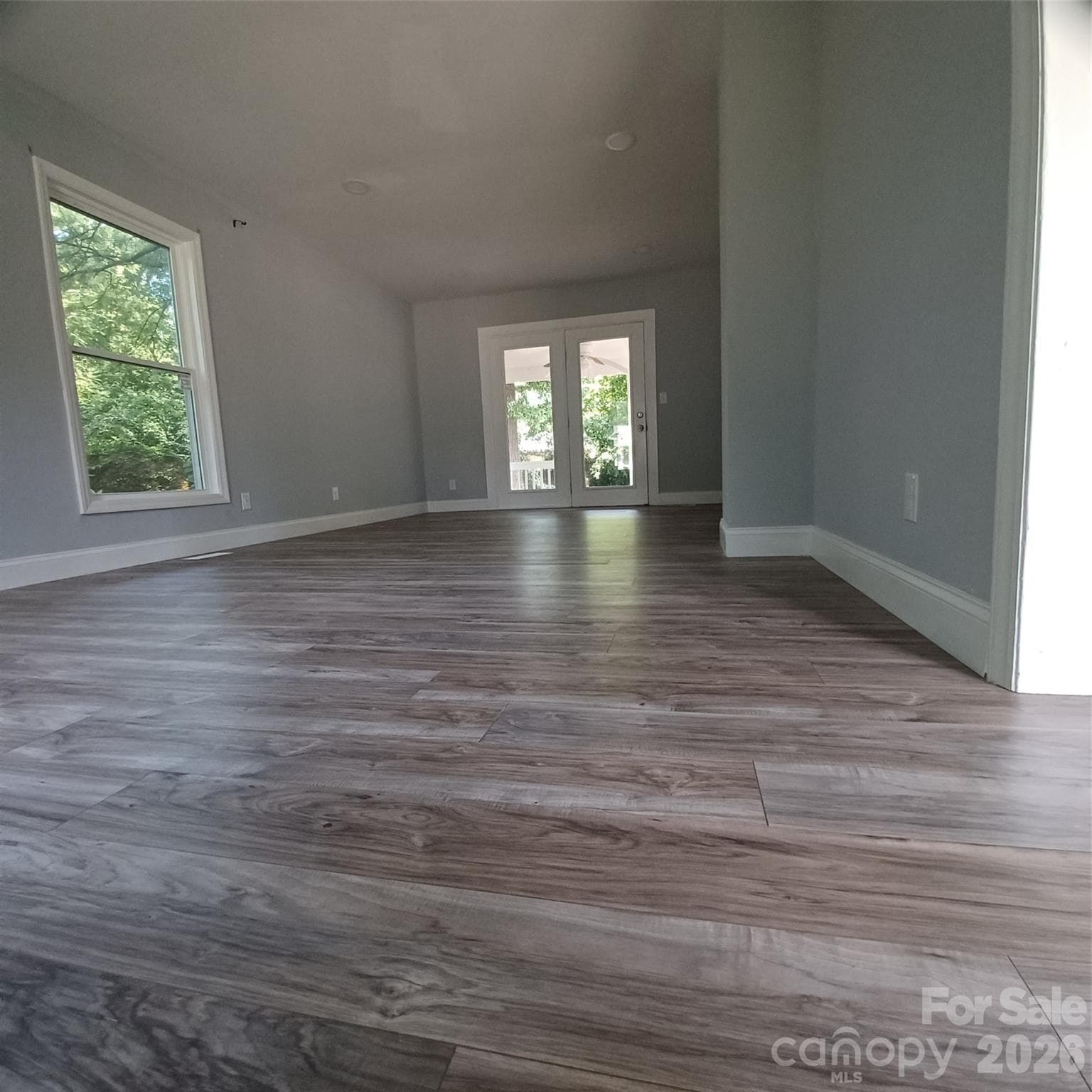 Family Room measuring 12 x 24 leading to 8 x 12 covered porch with french doors - 5717 Ruth Drive, Charlotte