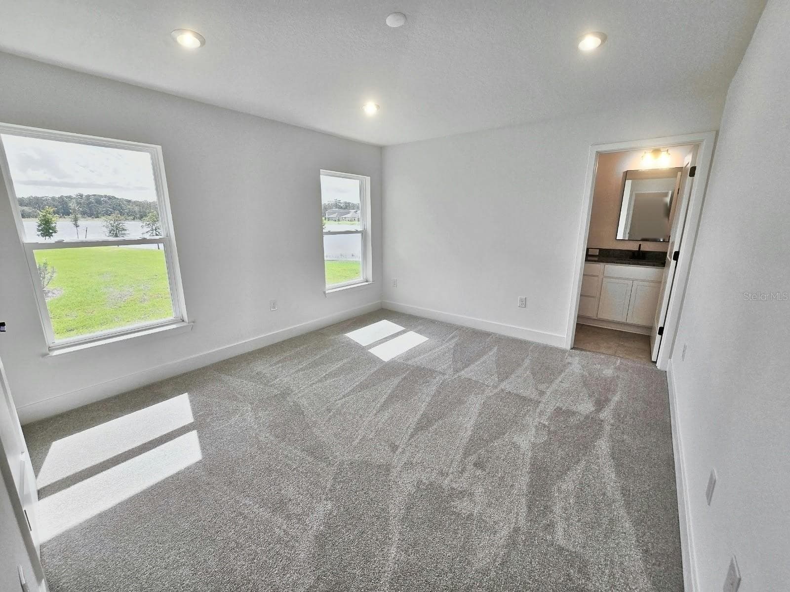 Primary bedroom with water view - 3614 BRIARLYNNE WAY, ST CLOUD