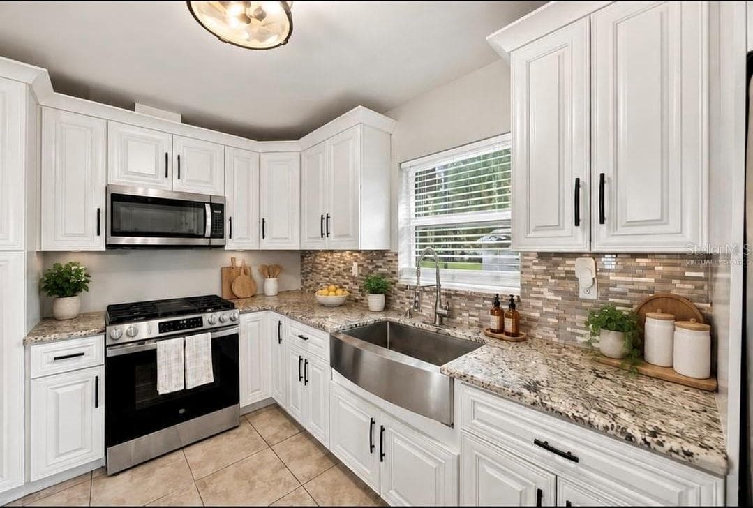 Main kitchen virtually staged - 5106 THONOTOSASSA RD, PLANT CITY