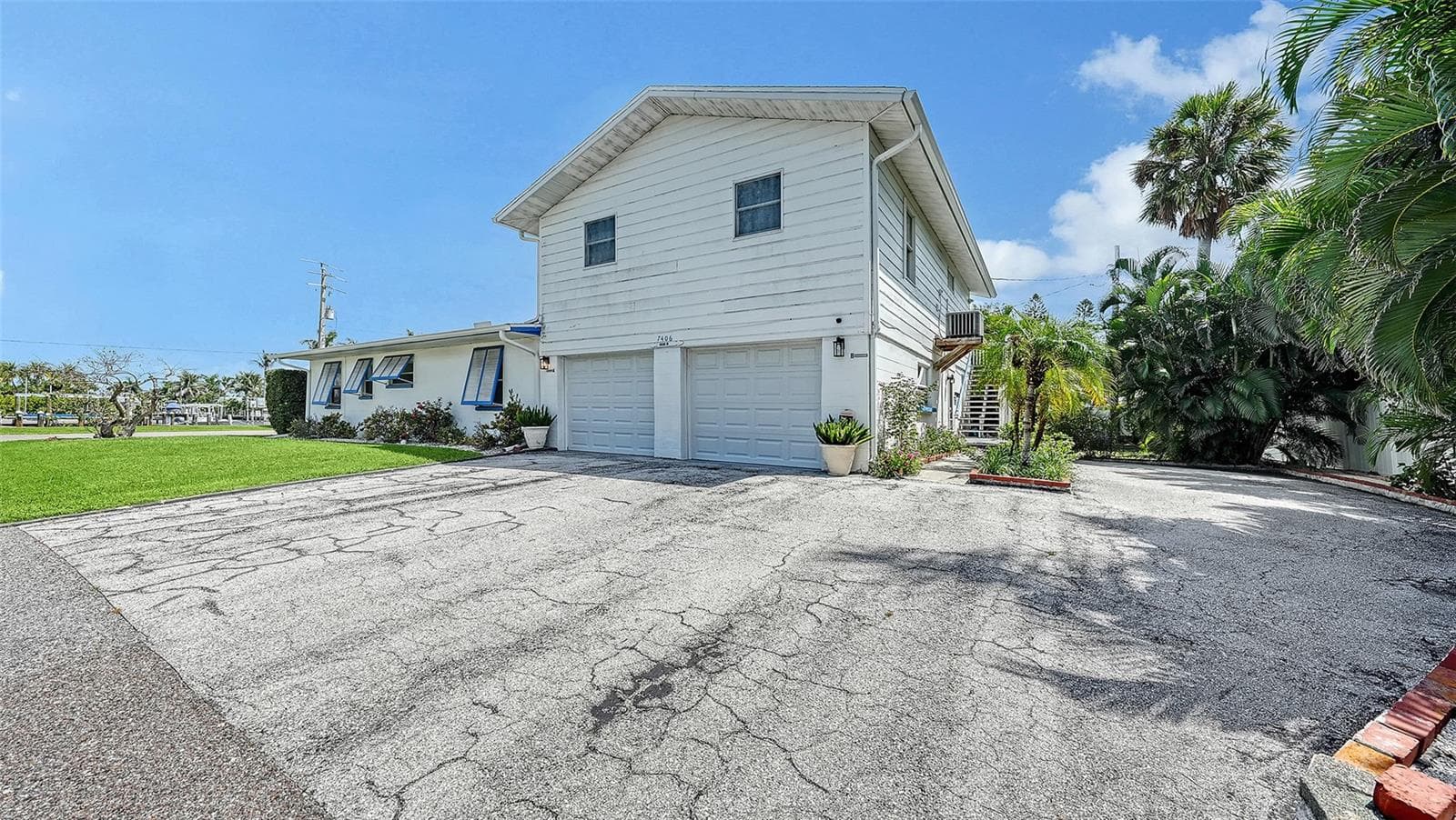 2 car garage for Apt A with side uncovered parking for Apt B - 7406 MARINA DR #A and B, HOLMES BEACH