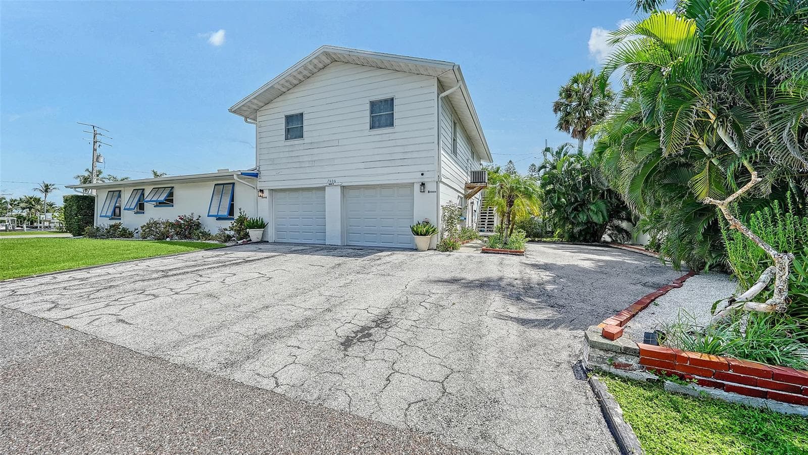 2 car garage for Apt A with side uncovered parking for Apt B - 7406 MARINA DR #A and B, HOLMES BEACH