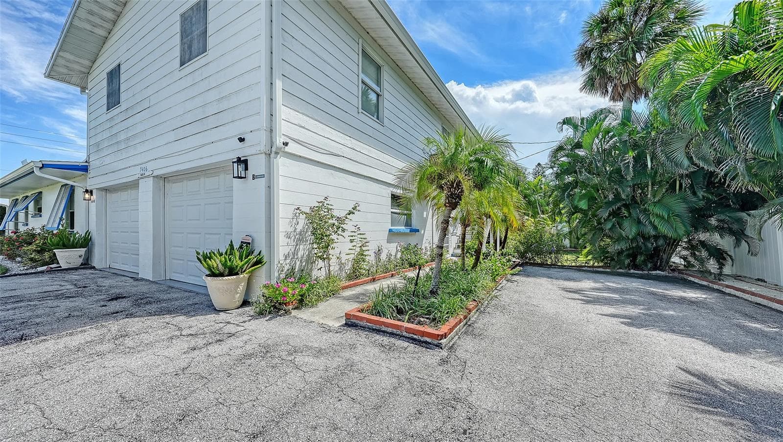 2 car garage for Apt A with side uncovered parking for Apt B - 7406 MARINA DR #A and B, HOLMES BEACH
