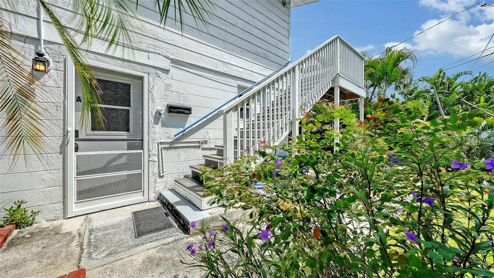 Side entrance up the stairs to Apt B - 7406 MARINA DR #A and B, HOLMES BEACH