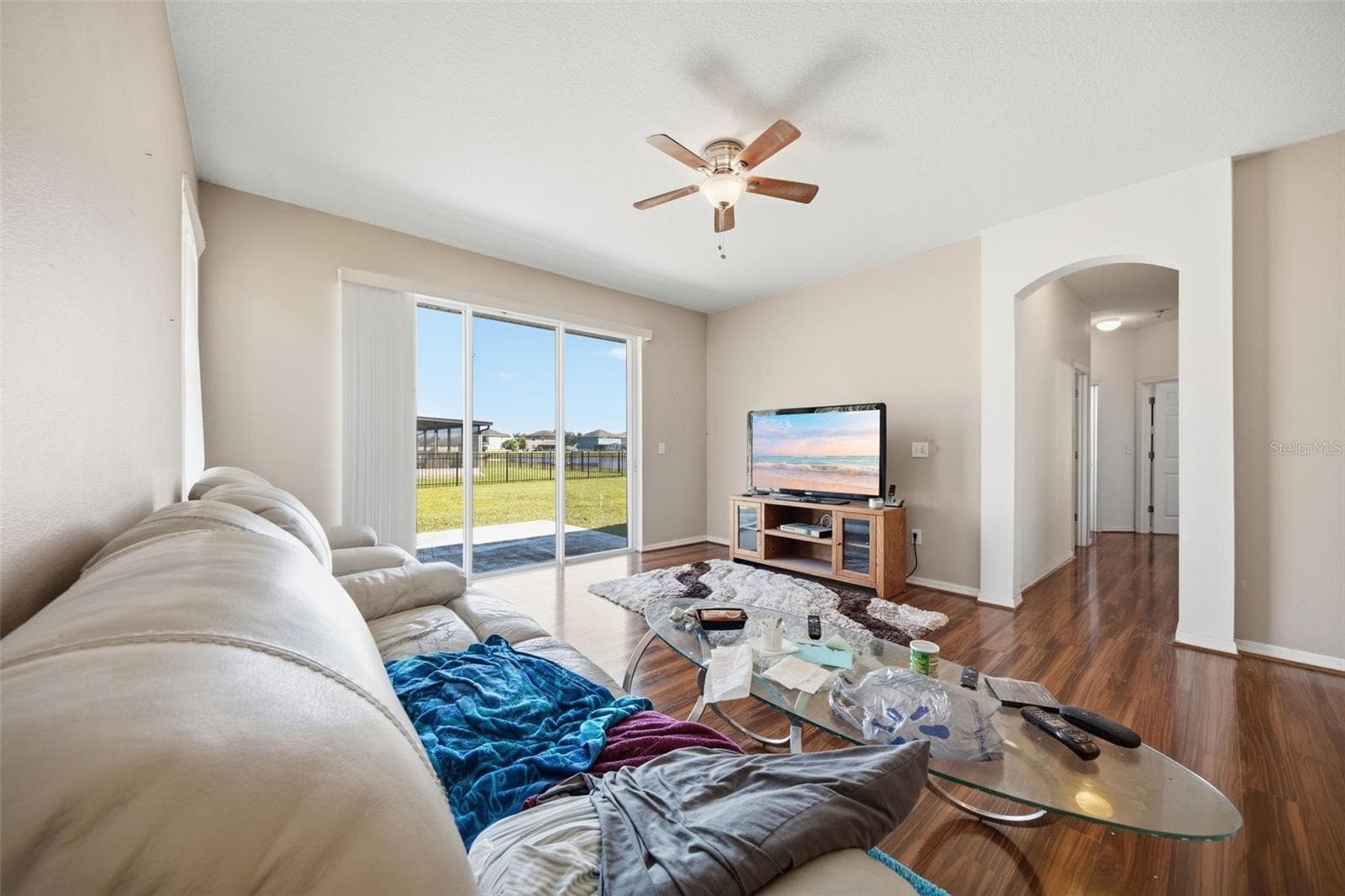 Family room with pond view through sliders - 10328 CELTIC ASH DR, RUSKIN