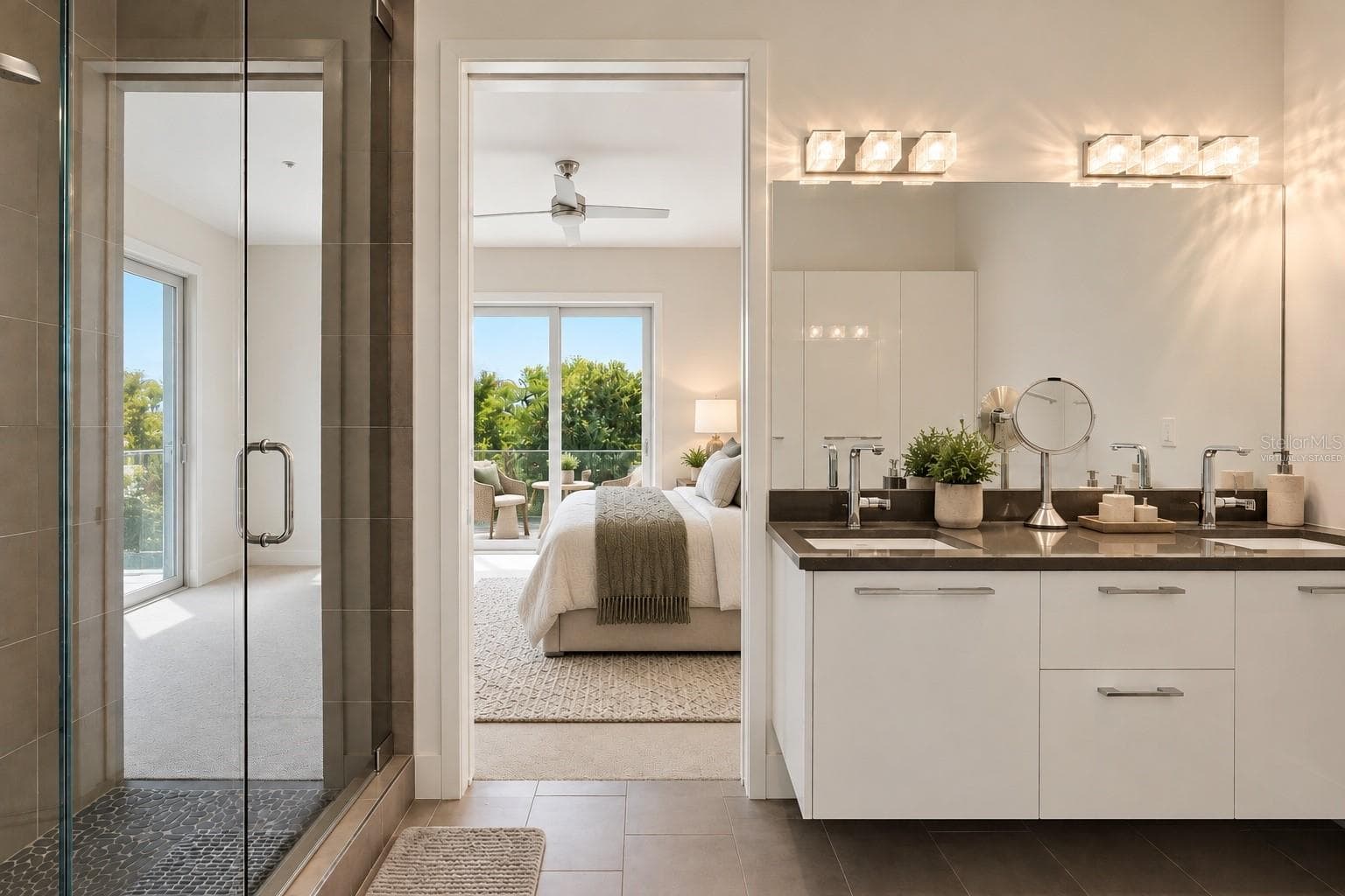 Virtually Staged Primary Bathroom looking into bedroom - 620 RAWLS AVE, SARASOTA