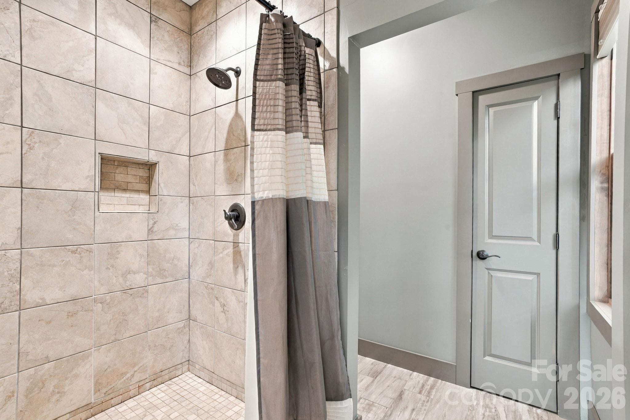 Tiled shower in primary bedroom - 1206 River Stone Drive, Laurel Springs
