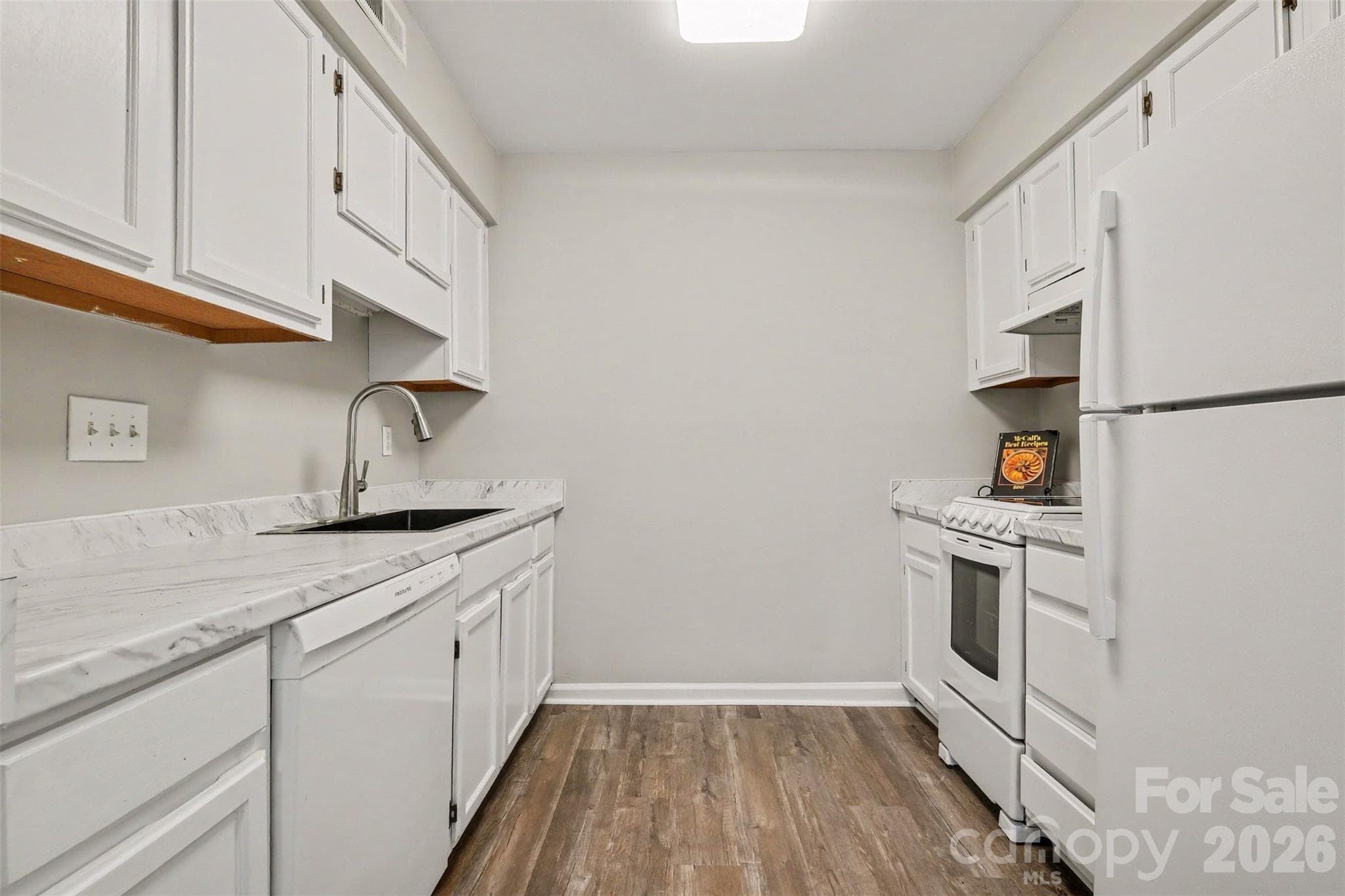 RENOVATED GALLEY KITCHEN - 3201 Heathstead Place, Charlotte