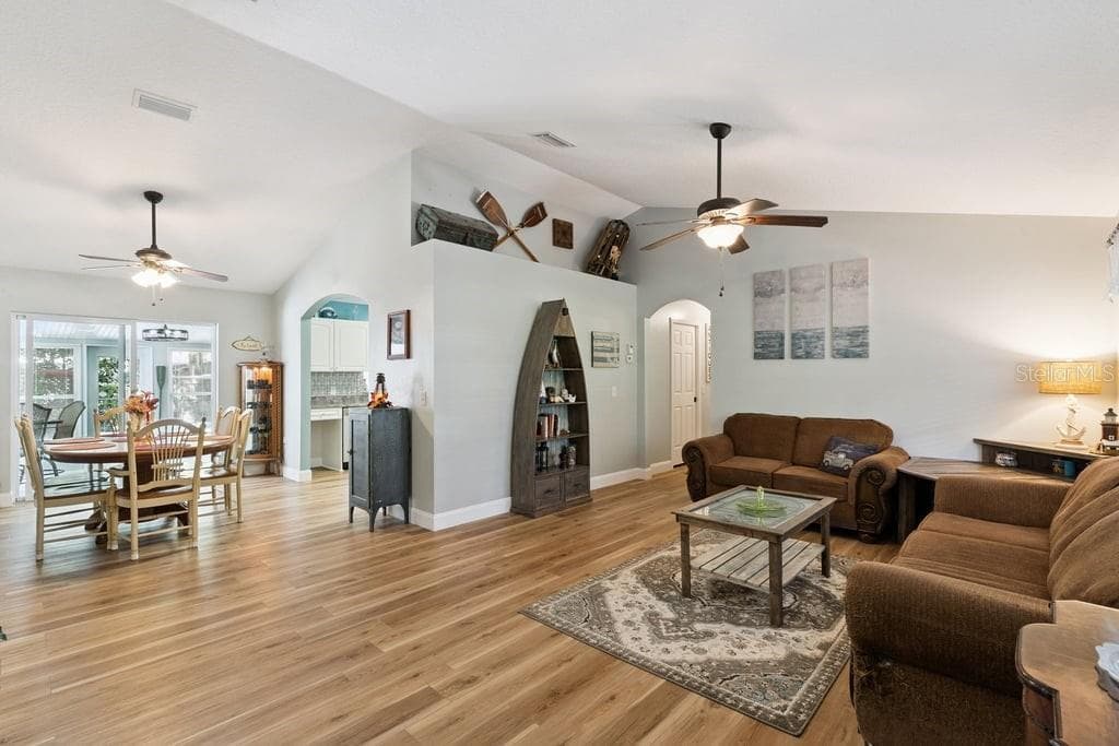 Livingroom dining room combo space with sliders to Florida Room - 30749 GLENN DR, TAVARES