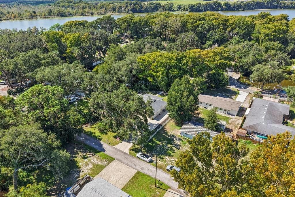 Street in front of house and aerial view of Lake Harris - 30749 GLENN DR, TAVARES