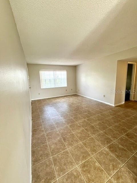 Living Room view from dining - 5325 CURRY FORD RD #B205, ORLANDO