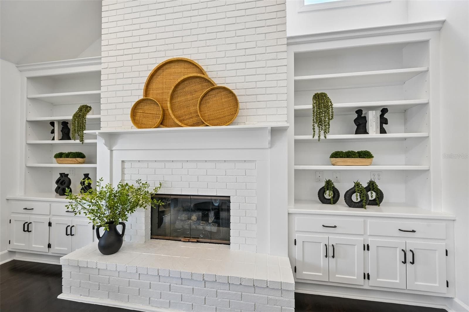 Beautiful white brick fire place with custom built-ins - 5060 18TH AVE W, BRADENTON