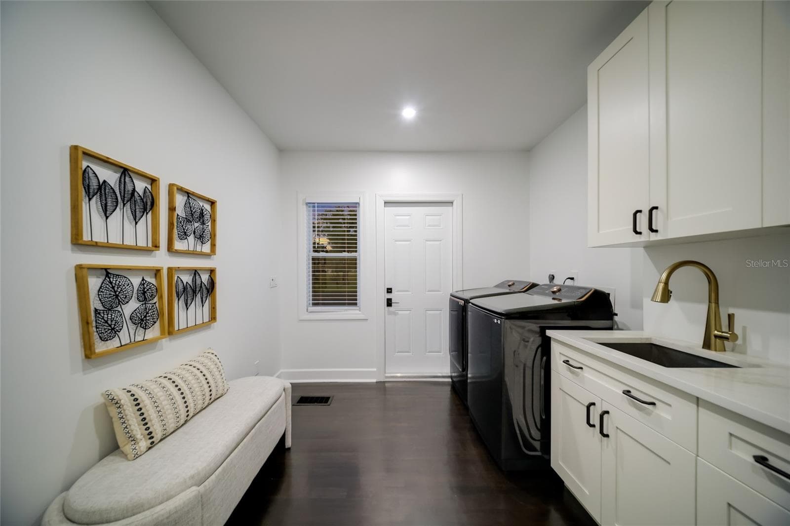 The perfect laundry room with access the the back yard, and garage. - 5060 18TH AVE W, BRADENTON