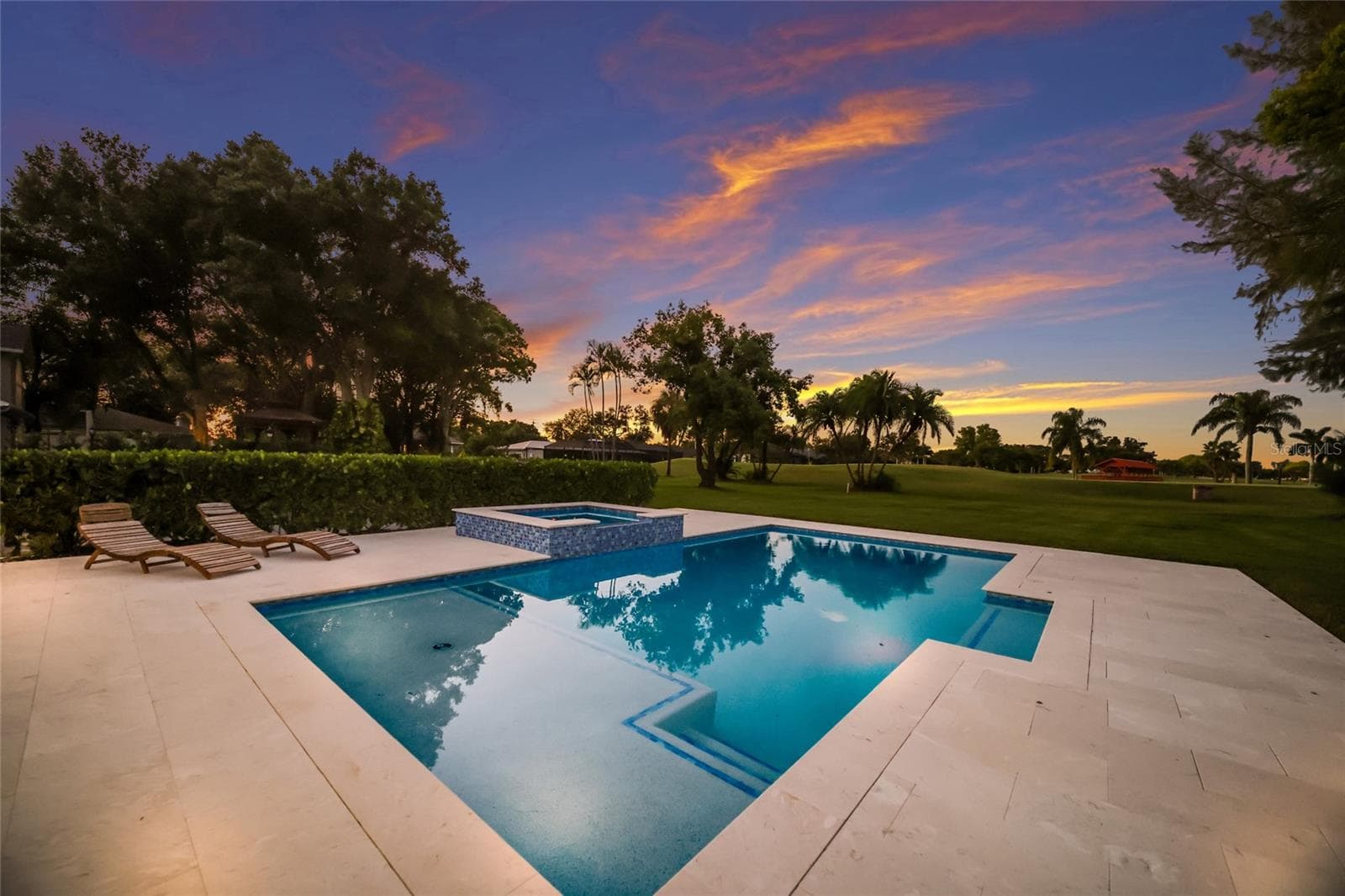 Spacious pool deck with large custom salt water pool and spa. - 5060 18TH AVE W, BRADENTON