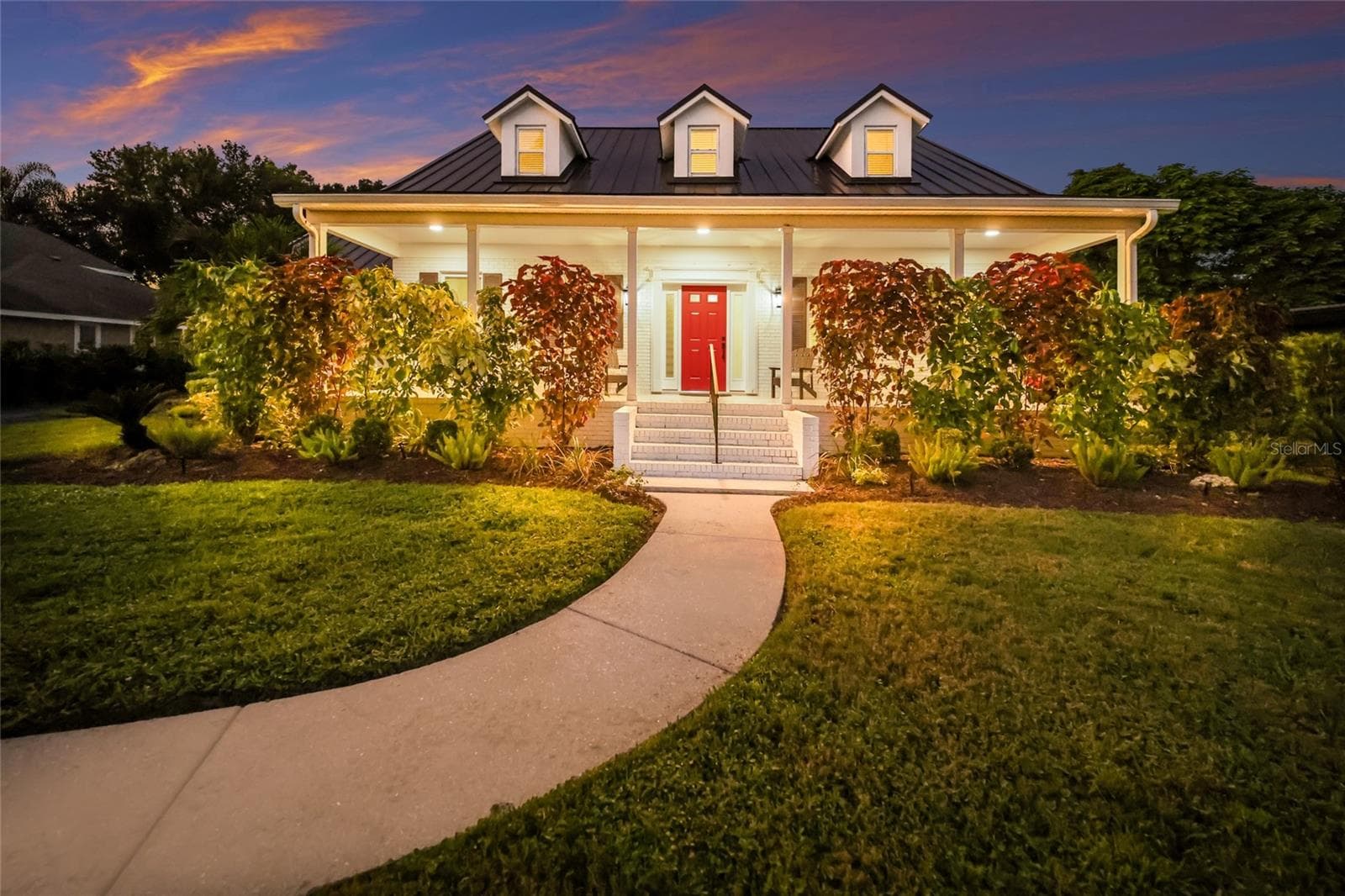 Front view at twilight. - 5060 18TH AVE W, BRADENTON