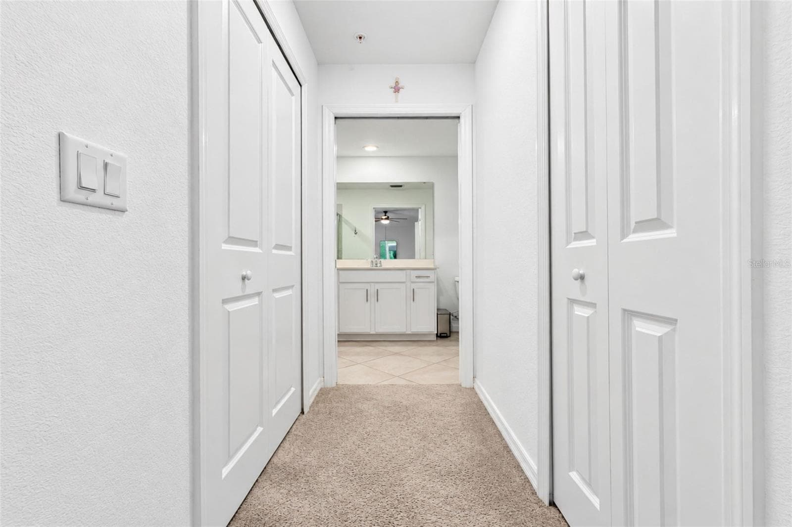 Primary Bedroom Hall to Bath - 14161 HERITAGE LANDING BLVD #1132, PUNTA GORDA